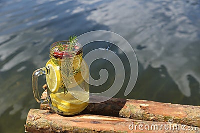 Infused water with wild strawberries lemon and blueberries Stock Photo