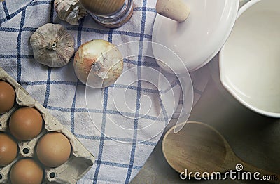 Ingredient in the kitchen with sunlight from the window. Close up view of ingredients of fried egg and vintage pot. Stock Photo