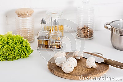 ingredientes and mushrooms on wooden board with knife Stock Photo