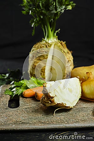 Ingredients for celeriac soup - celery root - celeriac, carrots, onion, potatoes Stock Photo