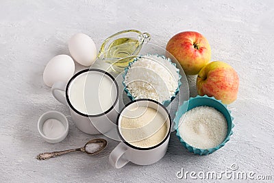 Ingredients for coconut cake, mannik: semolina or manka, yogurt, coconut flakes, eggs, vegetable oil, apples, sugar, eggs, baking Stock Photo