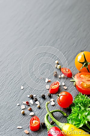 Ingredients for cooking with cherry tomatoes, herbs, chilis, cop Stock Photo