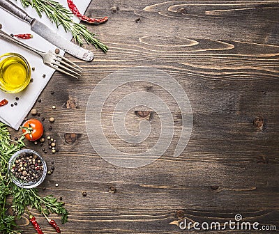 Ingredients for cooking vegetarian food, tomatoes, butter, herbs, colorful peppers on wooden rustic background top view border, pl Stock Photo