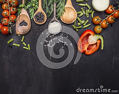 Ingredients for cooking vegetarian food wooden spoons, cherry tomatoes, dill, parsley, pepper border ,place text on wooden ru Stock Photo