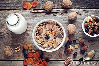 Ingredients for healthy breakfast: cereal wheat flakes and dried fruits Stock Photo