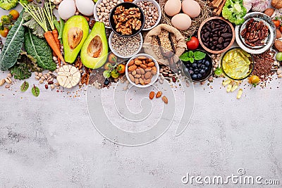 Ingredients for the healthy foods selection. The concept of superfoods set up on white shabby concrete background with copy space Stock Photo