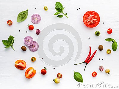 The ingredients for homemade pizza on white wooden background Stock Photo