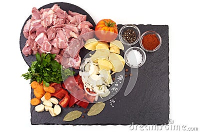 Ingredients for Hungarian goulash, isolated on white background. Place for text on a slate stone plate Stock Photo