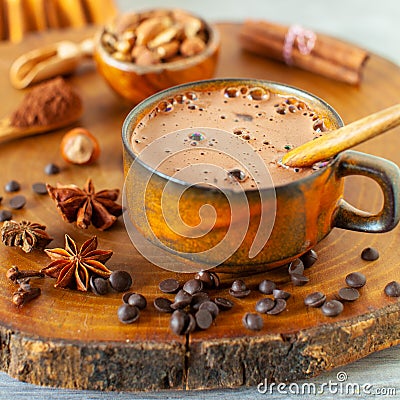 Ingredients for making winter hot chocolate with cinnamon and other spices Stock Photo