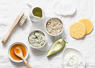 Ingredients for moisturizing, nourishing, anti-aging wrinkle face mask - avocado, olive oil, oatmeal, natural yogurt on light back Stock Photo