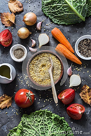 Ingredients for vegetarian delicious lunch - roasted savoy cabbage stuffed with spicy bulgur. Savoy cabbage, vegetables, bulgur on Stock Photo