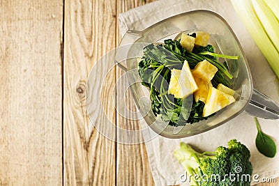 Ingrediets for green smoothie - parsley, spinach, broccoli and celery on wooden table Stock Photo