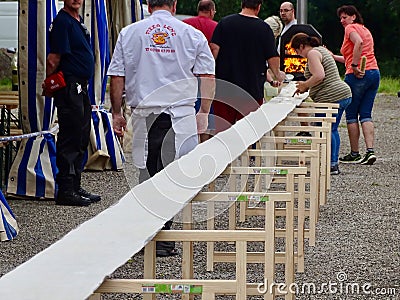 Ingwiller, France - June 9 2018 : World's Longest Flammekueche, Record-Breaking Tarte Flambée Event in Alsace Editorial Stock Photo