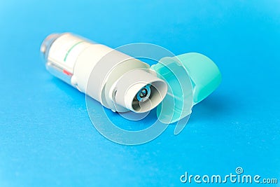 inhaler against asthma on blue background. COPD Stock Photo