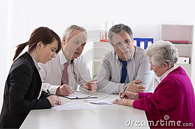 Inheritance counselor meeting with Senior woman Stock Photo