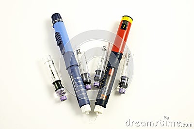 Injection pens and cartridge on a white background. Stock Photo