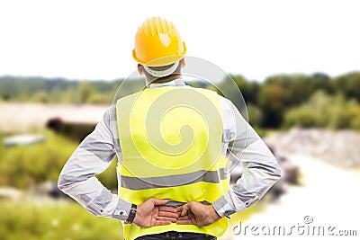 Injured construction worker or engineer suffering backpain Stock Photo