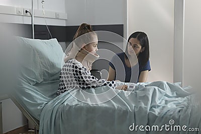 Injured daughter suffering from neck pain because of car accident wearing cervical collar Stock Photo