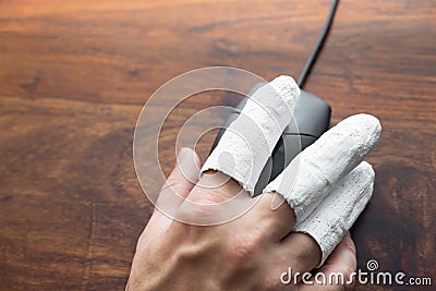 Injured hand with PC mouse Stock Photo