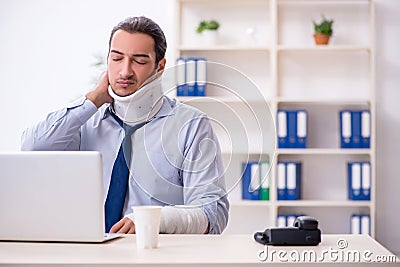 Injured male employee at workplace after accident Stock Photo