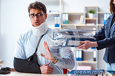 The injured man getting more work from his boss Stock Photo