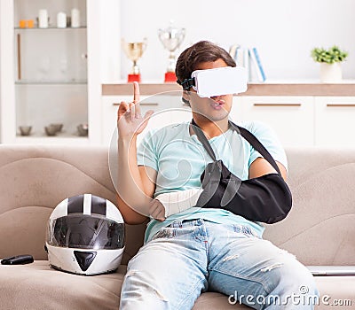 Injured motorbike rider recovering at home Stock Photo