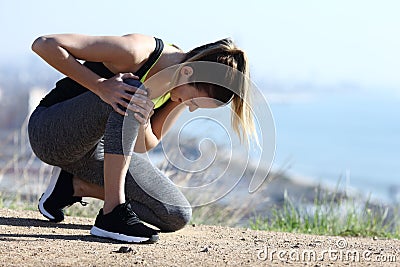 Injured runner complaining suffering knee ache Stock Photo