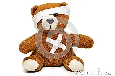 Injured teddy bear with bandages Stock Photo