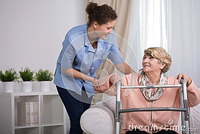 Injured woman with walker Stock Photo