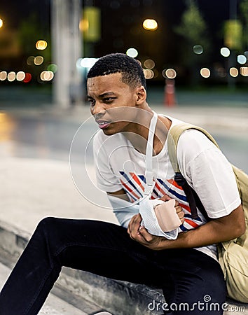 Injured young man with arm support Stock Photo