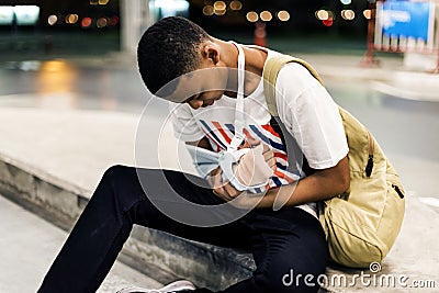 Injured young man with arm support Stock Photo