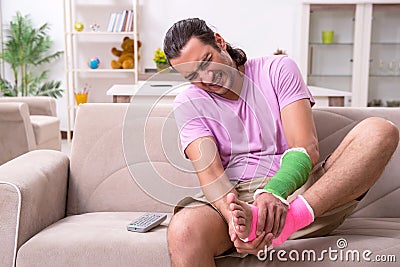 Injured young man at home Stock Photo