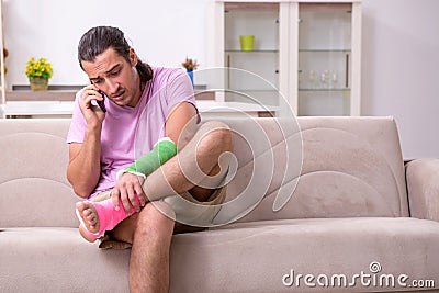 Injured young man at home Stock Photo