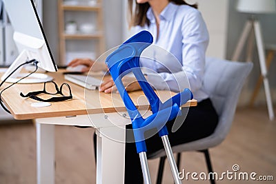 Injured Young Worker In Office After Accident Stock Photo