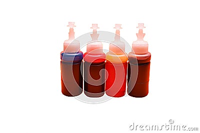 Ink for inkjet printer in bottles on white background. 4 basic colors - cyan blue, magenta, yellow, black Stock Photo