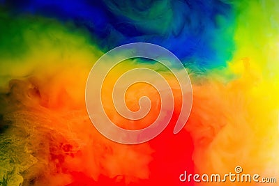 Ink in the water.Splash of red, blue, yellow and green paint. Abstract background Stock Photo