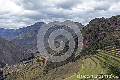 Inka ruins with Andens, stair-step like agricultural terrace dugs into the slope of a hillside in Pisac Archeological park, Peru Stock Photo