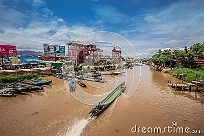 Inle Boat Station in Inle Nyaung Shwe Canal. A series of fishing boats along the river generated by Inle Lake. Editorial Stock Photo