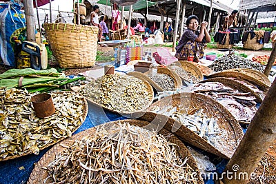 Inle lake, Myanmar - 5 July 2015: Woman sells fish on local Asia Editorial Stock Photo