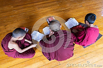 Inle, Myanmar - April 2019: Burmese monks studying in the monastery Editorial Stock Photo