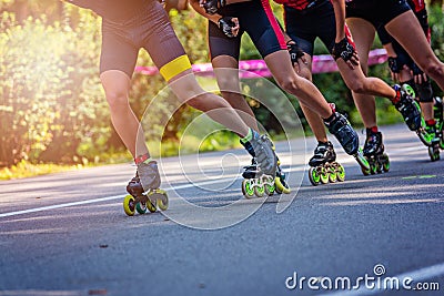 Inline roller skaters racing in the park o Stock Photo