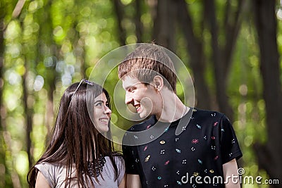 Inlove couple taking a walk in the forest Stock Photo