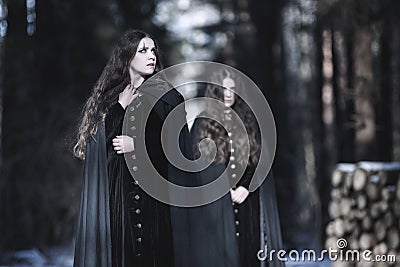 Inner demons. A woman in Victorian dress. Stock Photo
