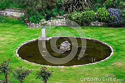 Inner garden with a small pond and a fountain in Windsor Castle Stock Photo