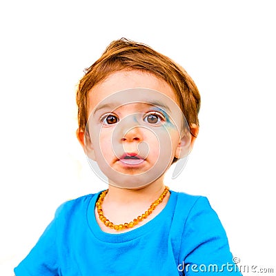 Innocent baby face isolated painted blue face expression newborn Stock Photo