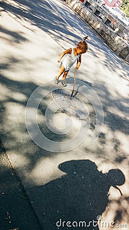 Innocent little girl playing with poverty Editorial Stock Photo