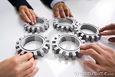 Innovative Businesspeople Team Hands Joining Gears Stock Photo