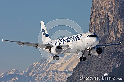 Finnair Airbus A320 landing in Innsbruck in Austria with some mountains around the airport Editorial Stock Photo