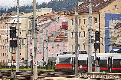 Innsbruck railway station and multicolored houses facades. Austrian transportation Stock Photo