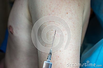 inoculation in the hand, vaccination, injection, syringe in the hands of a doctor, immunization coronavirus Stock Photo